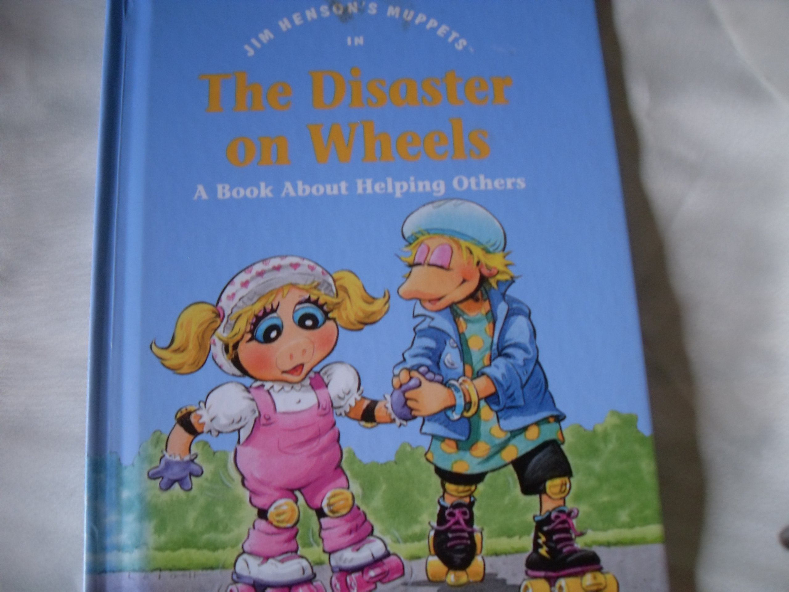 Jim Henson's Muppets in The disaster on wheels: A book about helping others (Values to grow on),Used