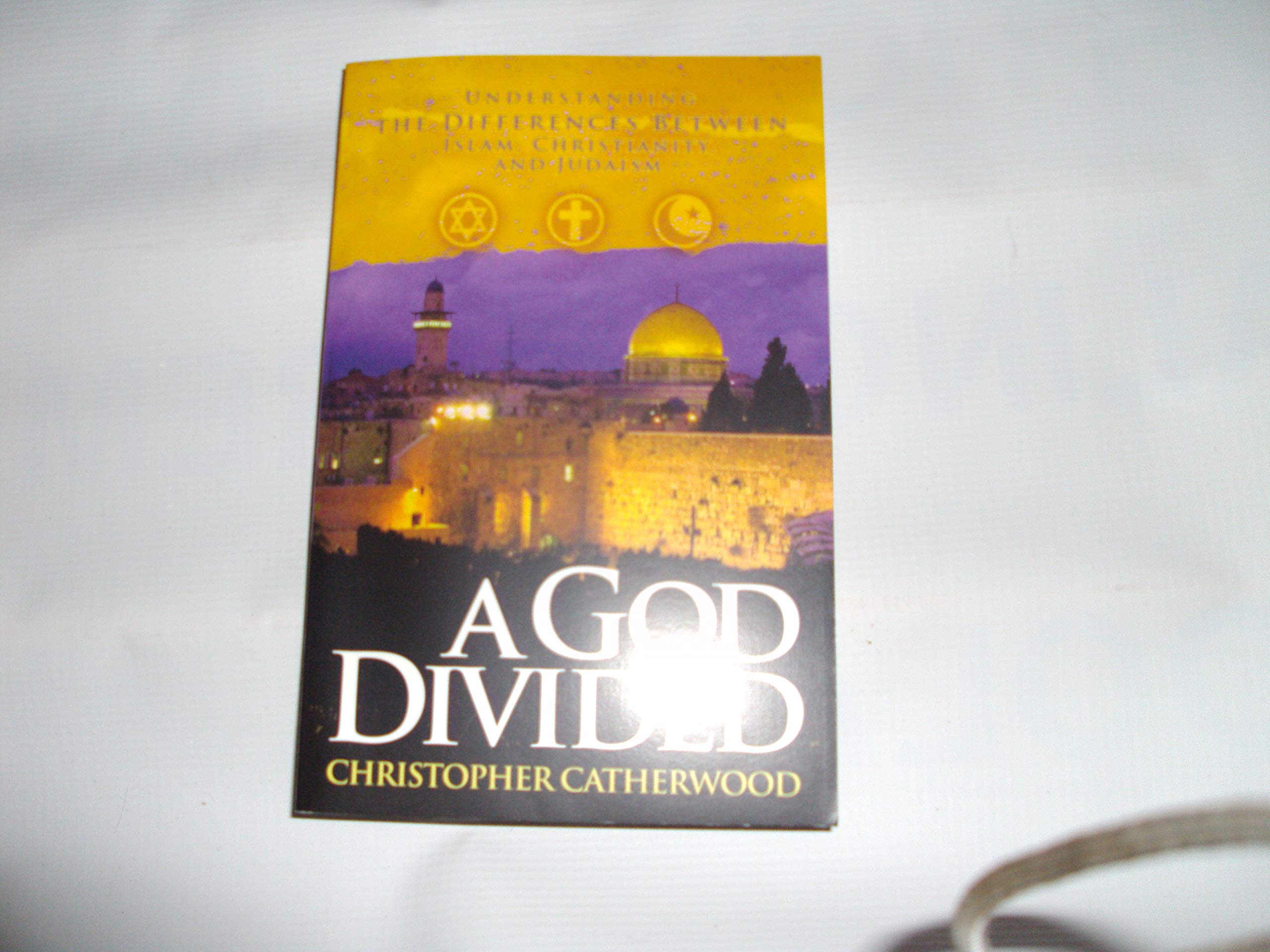 A God Divided: Understanding the Differences Between Islam, Christianity, a,Used