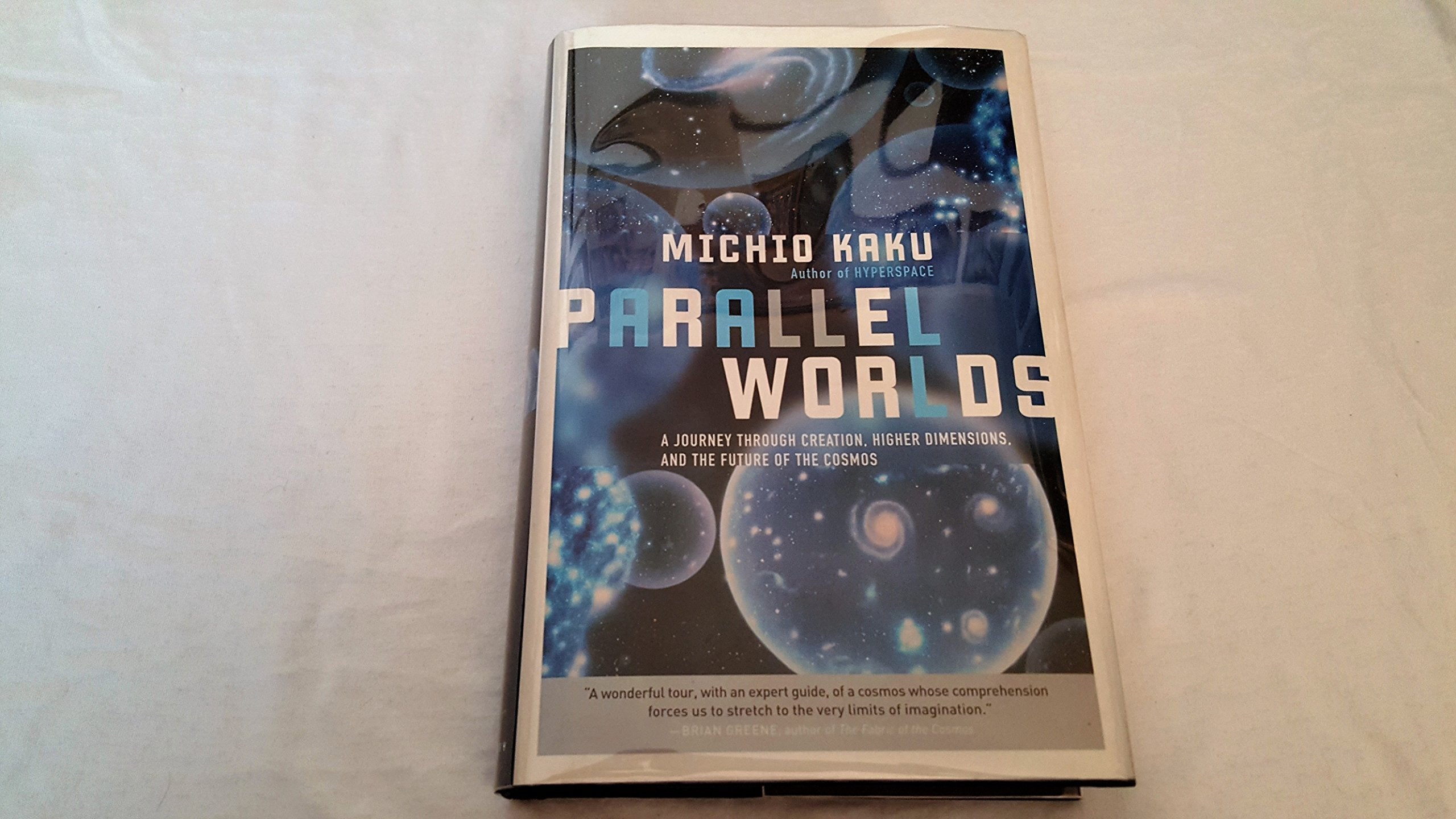 Parallel Worlds: A Journey Through Creation, Higher Dimensions, And The Future Of The Cosmos,Used