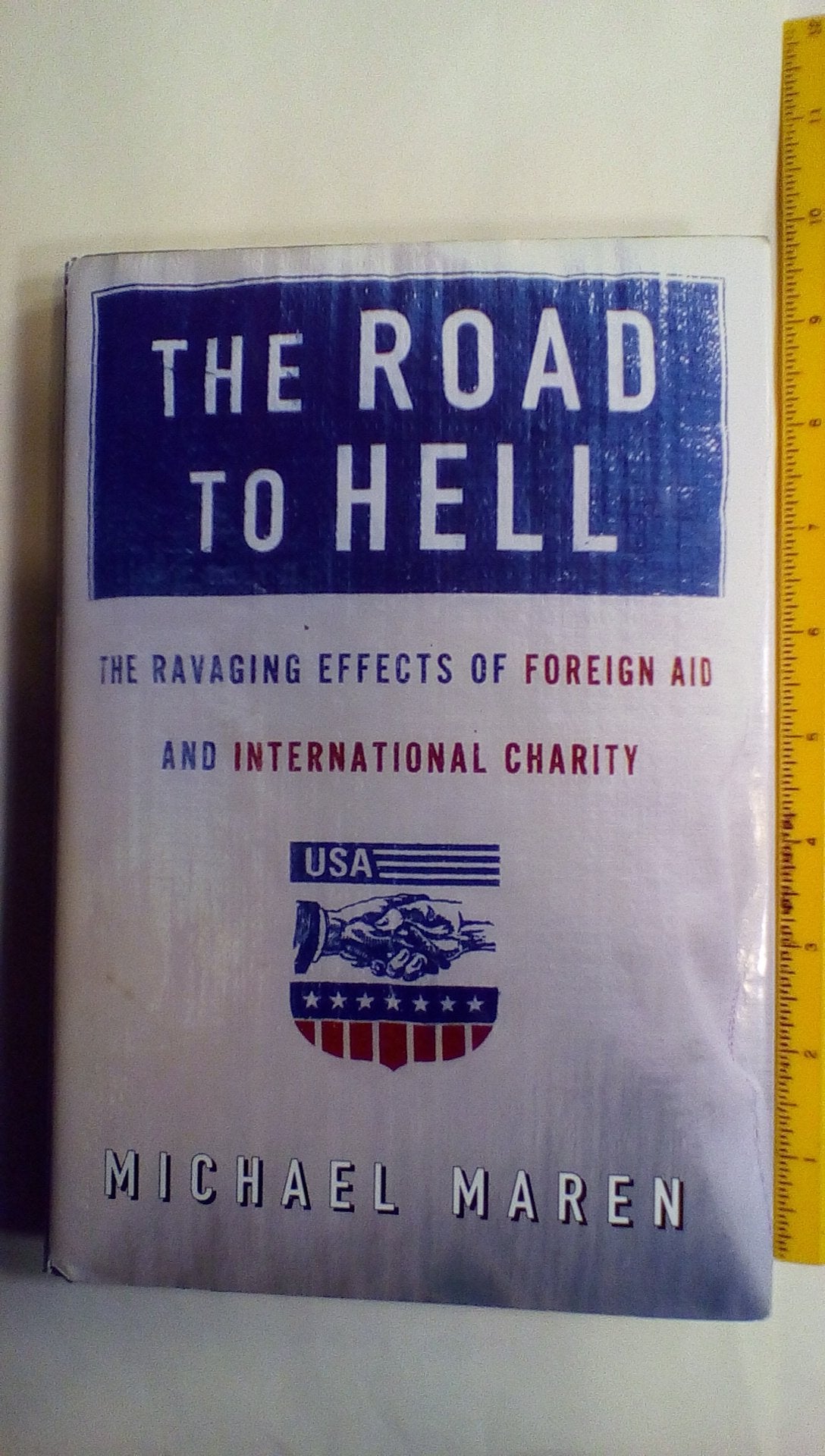 The Road to Hell: The Ravaging Effects of Foreign Aid and International Charity,New