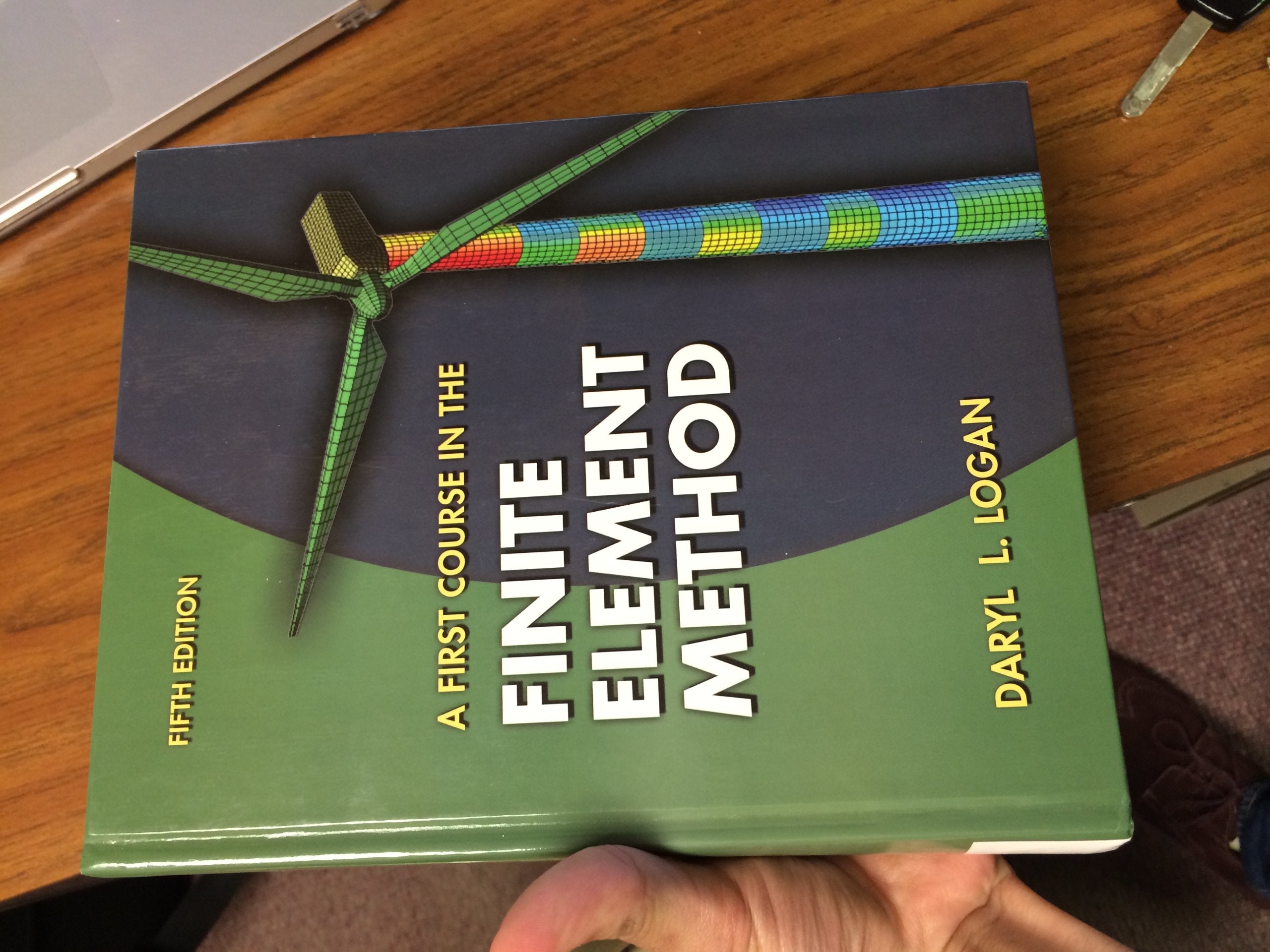 A First Course in the Finite Element Method,New